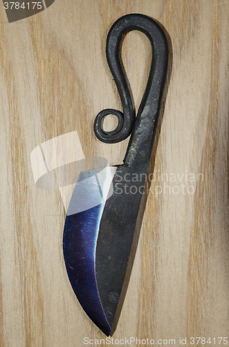 Image of traditional finnish knife puukko on wooden