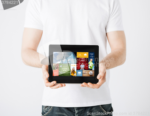Image of close up of man with tablet pc and web pages