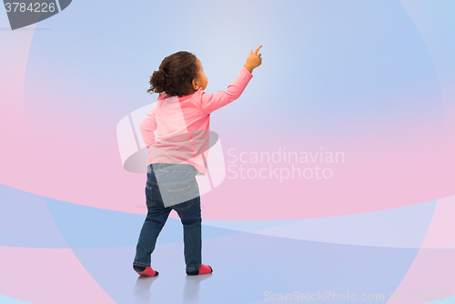 Image of african baby girl pointing finger to something