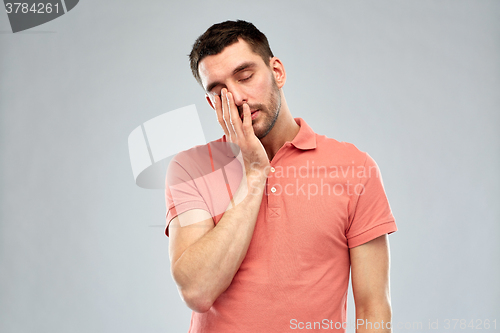 Image of young man suffering from headache