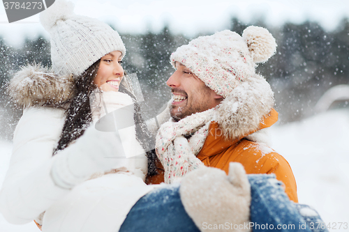 Image of happy couple outdoors in winter