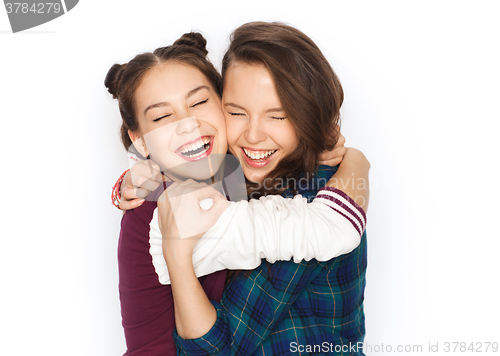 Image of happy smiling pretty teenage girls hugging