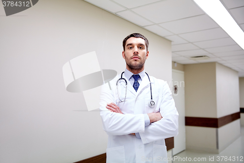 Image of doctor with stethoscope at hospital corridor