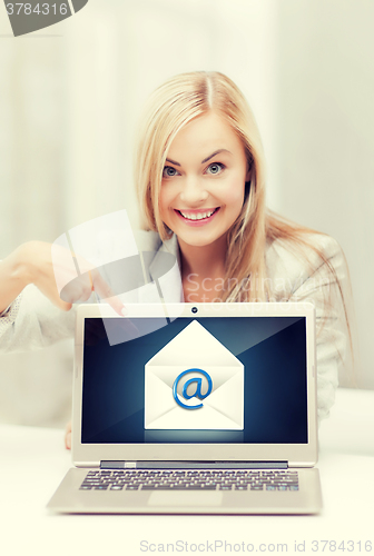 Image of woman with laptop pointing at email sign