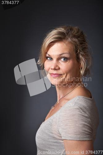 Image of Cute blond girl shot in studio