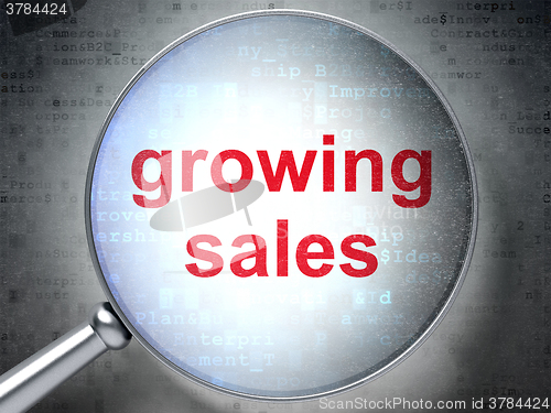 Image of Finance concept: Growing Sales with optical glass