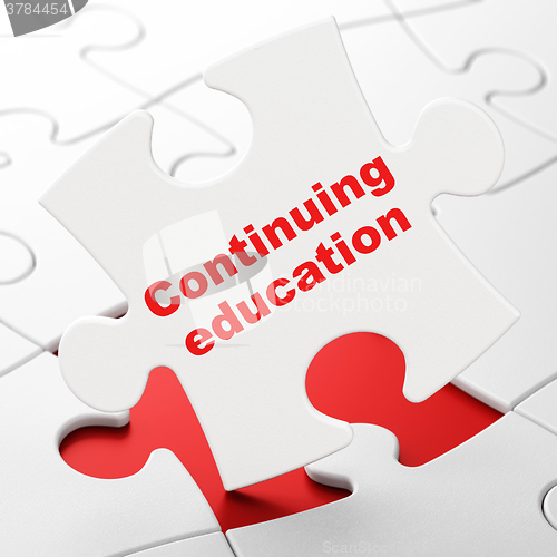 Image of Learning concept: Continuing Education on puzzle background