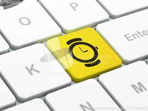 Image of Timeline concept: Watch on computer keyboard background