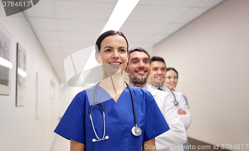 Image of group of happy medics or doctors at hospital