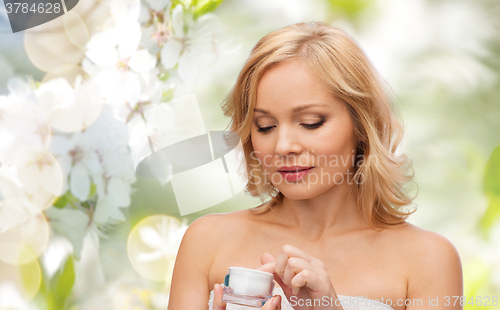 Image of middle aged woman with cream jar
