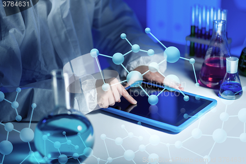 Image of close up of scientist with tablet pc in laboratory