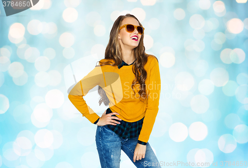 Image of happy young woman or teen girl in casual clothes