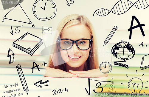 Image of student with stack of books and doodles