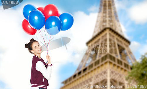 Image of teenage girl with balloons over eiffel tower