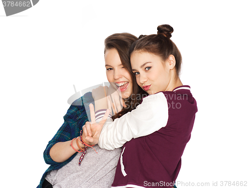 Image of happy teenage girls hugging and showing peace sign