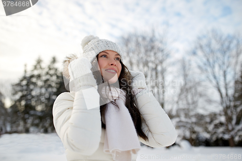 Image of happy woman outdoors in winter