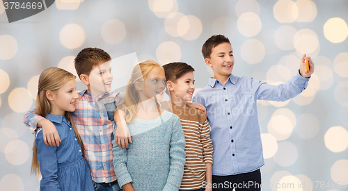 Image of happy children talking selfie by smartphone