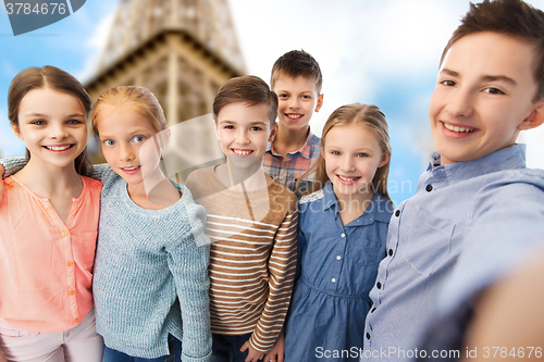 Image of happy children talking selfie over eiffel tower