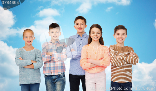 Image of happy smiling children over blue sky