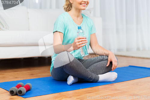 Image of close up of woman with water exercising at home