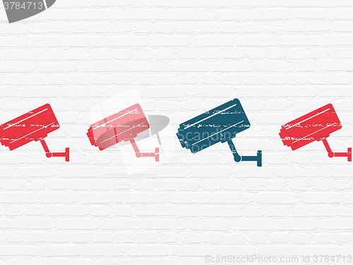 Image of Security concept: cctv camera icon on wall background