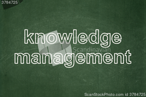 Image of Studying concept: Knowledge Management on chalkboard background