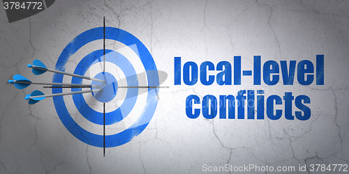 Image of Politics concept: target and Local-level Conflicts on wall background