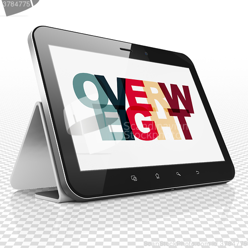 Image of Medicine concept: Tablet Computer with Overweight on  display