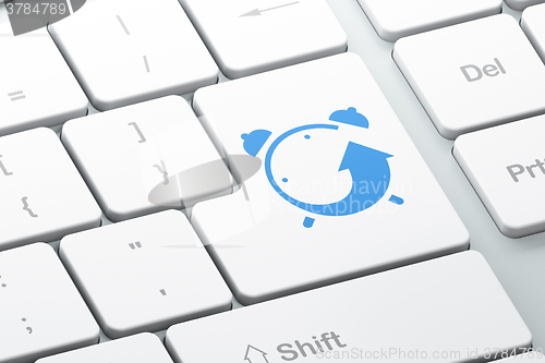 Image of Time concept: Alarm Clock on computer keyboard background