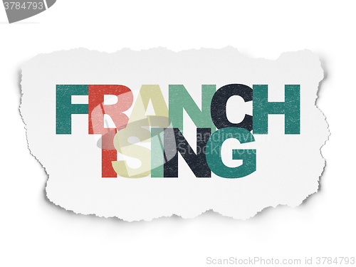 Image of Finance concept: Franchising on Torn Paper background