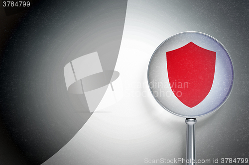 Image of Privacy concept:  Shield with optical glass on digital background