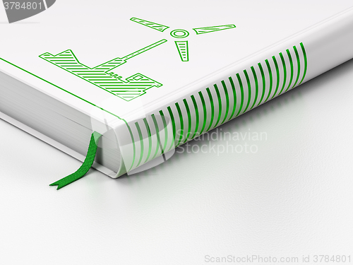 Image of Manufacuring concept: closed book, Windmill on white background
