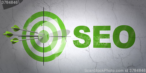 Image of Web development concept: target and SEO on wall background