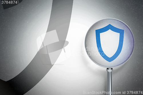 Image of Protection concept:  Contoured Shield with optical glass on digital background
