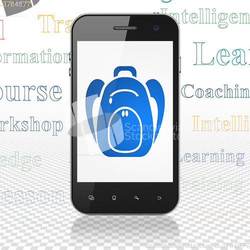 Image of Learning concept: Smartphone with Backpack on display