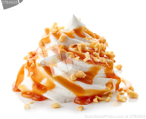 Image of whipped cream with caramel sauce on white background