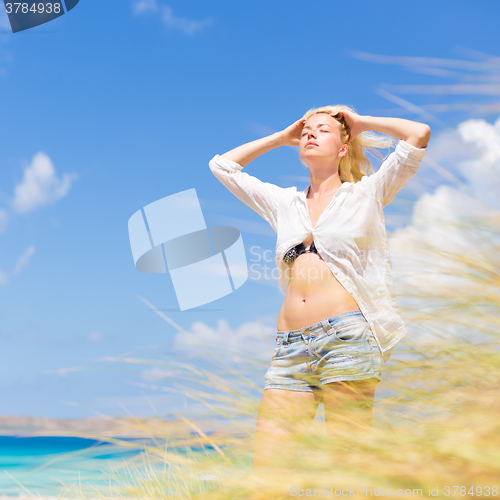 Image of Free Happy Woman Enjoying Sun on Vacations.
