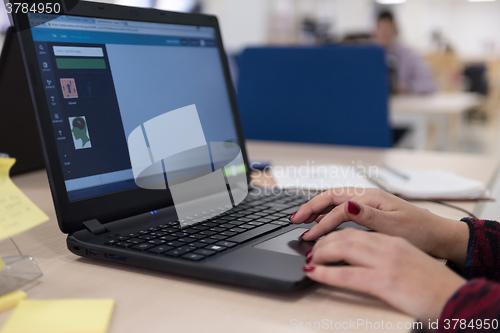 Image of startup business, woman  working on laptop