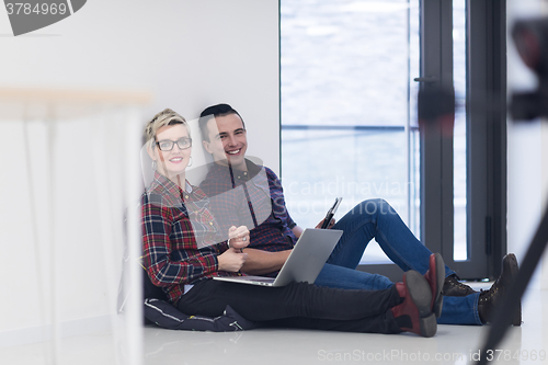 Image of startup business, couple working on laptop computer at office