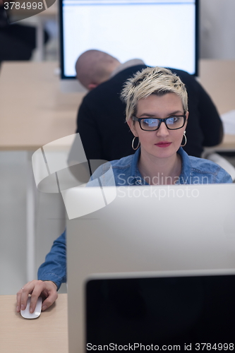 Image of startup business, woman  working on desktop computer