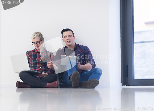 Image of startup business, couple working on laptop computer at office