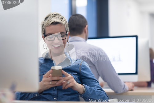 Image of startup business, woman  working on desktop computer