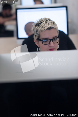 Image of startup business, woman  working on desktop computer