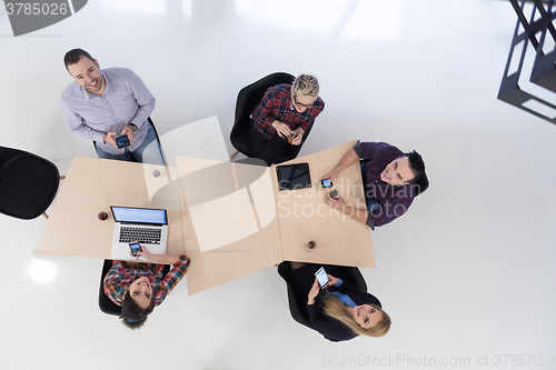 Image of aerial view of business people group on meeting