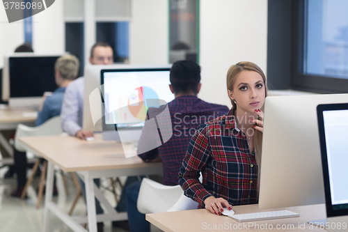 Image of startup business, woman  working on desktop computer