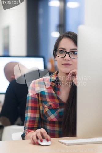 Image of startup business, woman  working on desktop computer