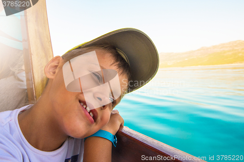 Image of boy on yacht
