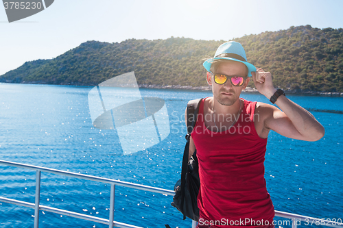 Image of man on yacht