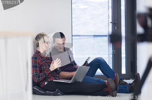 Image of startup business, couple working on laptop computer at office