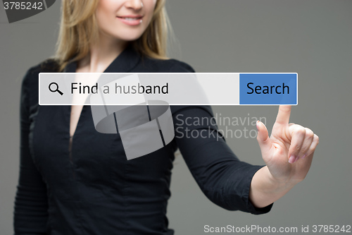 Image of woman presses button in the browser -  find a husband. technology and internet concept. 